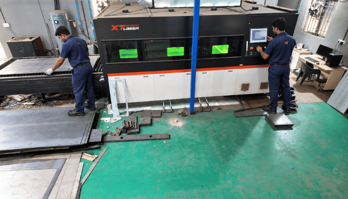 Laser cutting bay with sheet loading